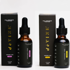Two boxes and two dropper bottles of DeVINE Wellness 1000mg Full Spectrum Tincture, in “Lemon” with yellow and “Lavender” with purple accents—each 30ml bottle offers organic CBD oil designed for relaxation.