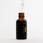 A brown glass bottle labeled DeVINE Wellness 1000mg Full Spectrum Tincture with a black dropper cap. A drop of CBD oil hovers above, highlighting relaxation against a white background.