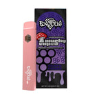 A pink Exodus Mushy Vape stands before its black and purple box decorated with mushroom illustrations and “Exodus Mushy Vape Delight Grape Punch,” along with the net weight.