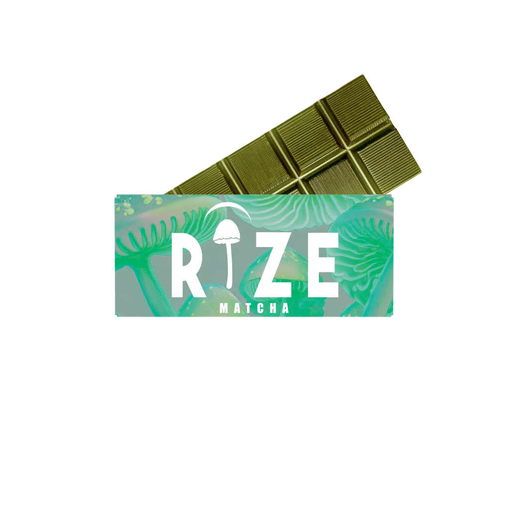 A green Rize 5G Mushroom Chocolate Bar, partially unwrapped to show its leafy design and mushroom illustration, sits on a white background, hinting at a unique magic mushroom blend.
