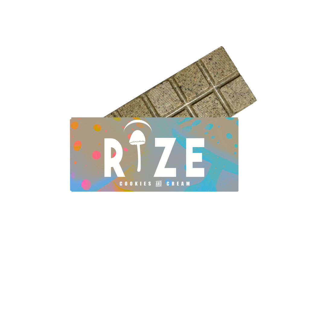 The Rize 5G Mushroom Chocolate Bar, partially wrapped in colorful packaging with a white mushroom above the “I” in RIZE, offers a consistent magic mushroom chocolate experience in every bite.