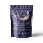A stand-up pouch labeled GummieZzz by DeVINE Wellness, featuring a crescent moon, holds CBD sleep gummies with CBN, GABA, and L-Theanine; available in blackberry and pomegranate flavors for restful sleep support.